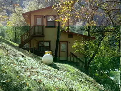a house on the side of a hill at Yosemite Gatekeeper's Lodge in El Portal