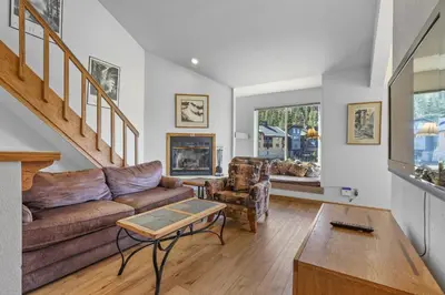 a living room with a couch and a table at Sierra Cabin Condo – Sun Meadows 1 BedroomLoft condo in Kirkwood