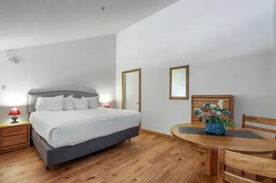 a hotel room with a bed and a table at Sierra Cabin Condo – Sun Meadows 1 BedroomLoft condo in Kirkwood