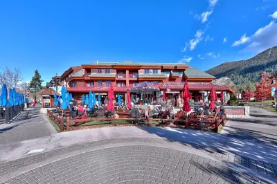 a building with tables and chairs in front of it at Sierra Shores Four - Lakefront Vistas in South Lake Tahoe