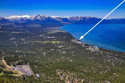 an aerial view of a lake and mountains at Sierra Shores Four - Lakefront Vistas in South Lake Tahoe