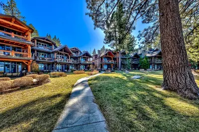 a large house with a pathway in front of it at Sierra Shores Five - Lakefront Comfort in South Lake Tahoe