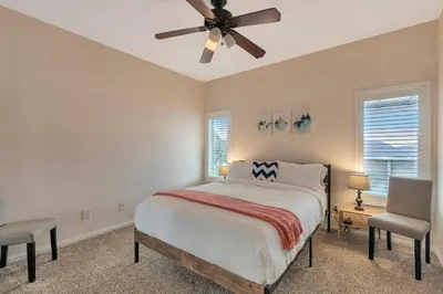 a bedroom with a bed and a ceiling fan at Stargazing Retreat: fire pit/hot tub near Yosemite in Ahwahnee