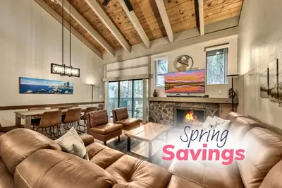 a living room with a couch and a fireplace at Lakeland Village 426 - Lakeland Luxury - Remodeled in South Lake Tahoe