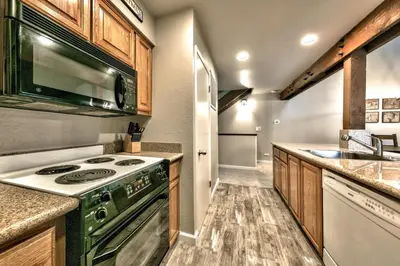 a kitchen with a stove and a sink at Lakeland Village 410 in South Lake Tahoe