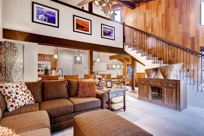 a living room with a couch and a fireplace at Lakeland Village 480 - Remodeled Close to Skiing 2BRLoft in South Lake Tahoe