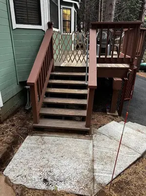 a wooden staircase leading to a house at Cedar Oasis - Pet Friendly Cabin w Fireplace, Games and Wifi - 5 min to Big Trees in Arnold