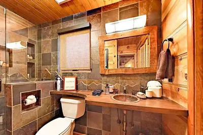 a bathroom with a toilet and a sink at 3988 Manzanita Avenue cabin in South Lake Tahoe
