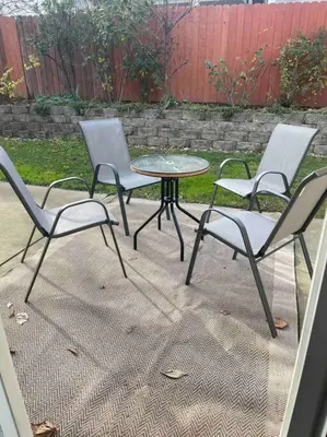 three chairs and a table and a table and chairs at Sweet Holiday in Antelope