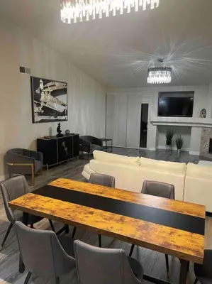 a room with a table and chairs and a couch at Sweet Holiday in Antelope