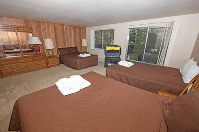 a hotel room with two beds and a television at 1629 Pioneer Trail home in South Lake Tahoe