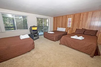 a hotel room with two beds and a television at 1629 Pioneer Trail home in South Lake Tahoe