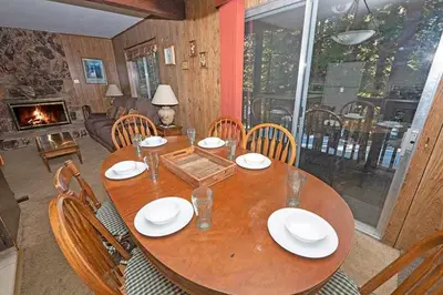 a wooden table with chairs and a dining room at 1629 Pioneer Trail home in South Lake Tahoe