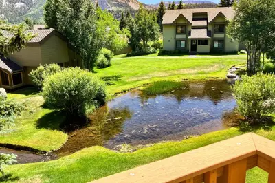 a house with a pond in the yard at Snowcreek 264 in Mammoth Lakes