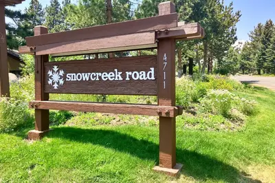 a sign for the snow sweep road at a park at Snowcreek 264 in Mammoth Lakes