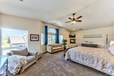 a bedroom with a bed and a ceiling fan at 1759 Venice Drive home in Tahoe Keys