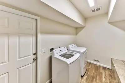 a white laundry room with a washer and dryer at 1759 Venice Drive home in Tahoe Keys
