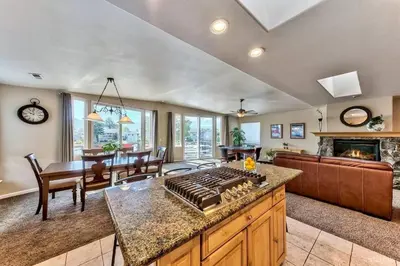 a kitchen and living room with a stove top oven at 1759 Venice Drive home in Tahoe Keys