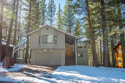 a house with a garage in the woods at 2293 Marshall Trail home in South Lake Tahoe