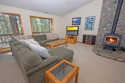 a living room with a couch and a fireplace at 2293 Marshall Trail home in South Lake Tahoe
