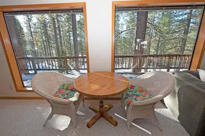 a living room with a wooden table and two chairs at 2293 Marshall Trail home in South Lake Tahoe