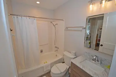 a bathroom with a toilet and a tub and a sink at 405 Ala Wai Blvd, 180 condo in South Lake Tahoe