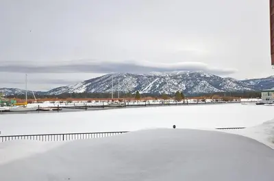 a view of a body of water with snow covered mountains at 405 Ala Wai Blvd, 180 condo in South Lake Tahoe