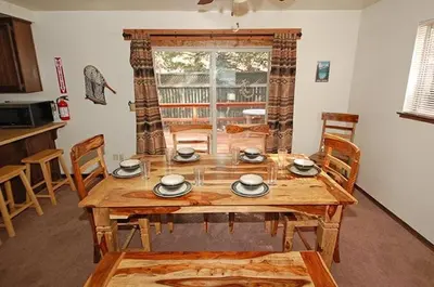 a wooden table and chairs in a living room at 1987 Cherokee St, home in South Lake Tahoe