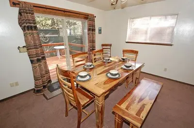 a dining room with a wooden table and chairs at 1987 Cherokee St, home in South Lake Tahoe