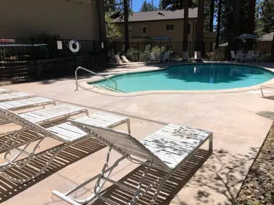 a group of chairs and a swimming pool at Fun & Air Conditioned Lake Tahoe 3 BR/2.5 BA Home in Incline Village