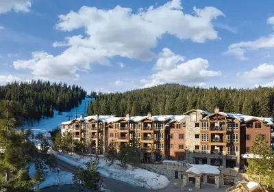 a view of a resort with a river and trees at Hyatt Vacation Club at Northstar Lodge in Truckee