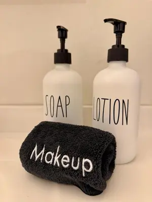 two bottles of soap and a mop and a towel at Private/Cozy Kings Beach Retreat in Tahoe Vista