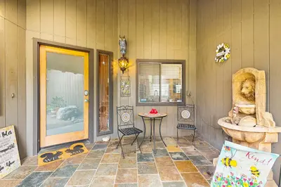 a room with a fountain in the corner of a building at Yard and Patio Quiet and Well-Stocked Riverside Home in Three Rivers