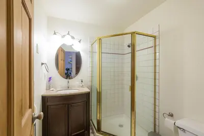 a bathroom with a shower and a sink and a mirror at Inside Yosemite Winter Wonderland in Yosemite West