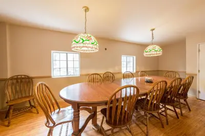 a dining room with a wooden table and chairs at Inside Yosemite Winter Wonderland in Yosemite West