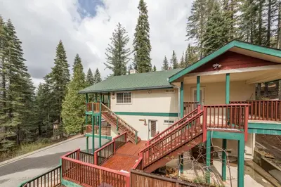 a house with a staircase leading up to it at Upper Cascades in Yosemite West