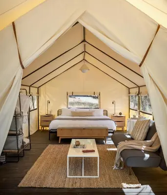 a bedroom with a bed in a tent at AutoCamp Sequoia in Three Rivers