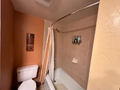a bathroom with a white toilet and a shower at Yosemite Condominium Loft unit -B202 in Yosemite West