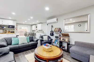 a living room with a couch and a table at Riverside Retreat in Bethel Island Fish and Boat! in Bethel Island