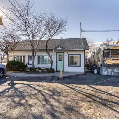 a bus is parked in front of a house at Charming Retro Property 8 in Sparks