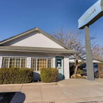 a house with a sign in front of it at Charming Retro Property 8 in Sparks