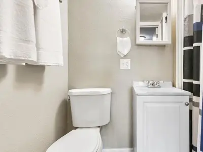 a small bathroom with a toilet and a sink at Charming Retro Property 22 in Sparks