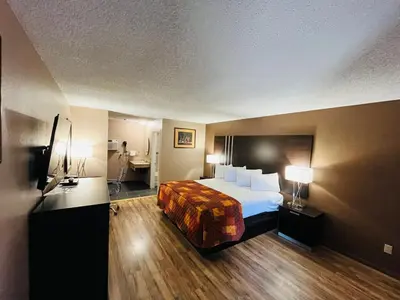 a hotel room with a bed and two lamps at Star Inn in Tonopah
