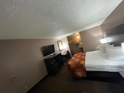 a hotel room with a bed and a television at Star Inn in Tonopah