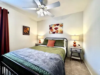 a bedroom with a bed and a ceiling fan at King Bed Retreat, Pet-Friendly, Rancho Cordova in Rancho Cordova