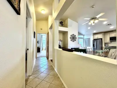 a kitchen and living room with a ceiling fan at King Bed Retreat, Pet-Friendly, Rancho Cordova in Rancho Cordova
