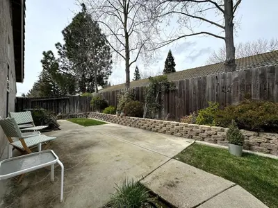 a patio with two chairs and a fence at King Bed Retreat, Pet-Friendly, Rancho Cordova in Rancho Cordova