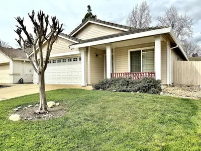a house with a tree in the front yard at King Bed Retreat, Pet-Friendly, Rancho Cordova in Rancho Cordova