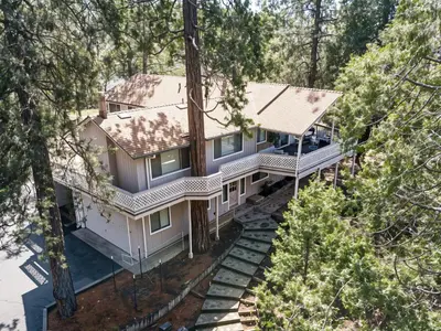 an overhead view of a house in the woods at Tranquil Retreat - Home with Spacious Deck & Grill home in Groveland