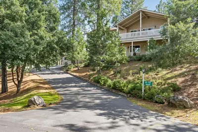 a road in front of a house at Tranquil Retreat - Home with Spacious Deck & Grill home in Groveland